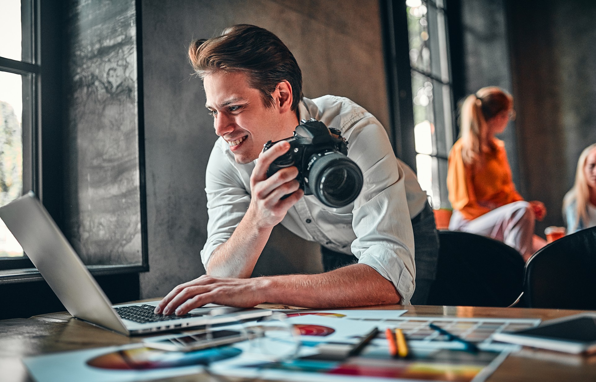Young cheerful photographer